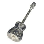 Ozark metal cased resonator guitar with all over chased foliate decoration to the polished finish an