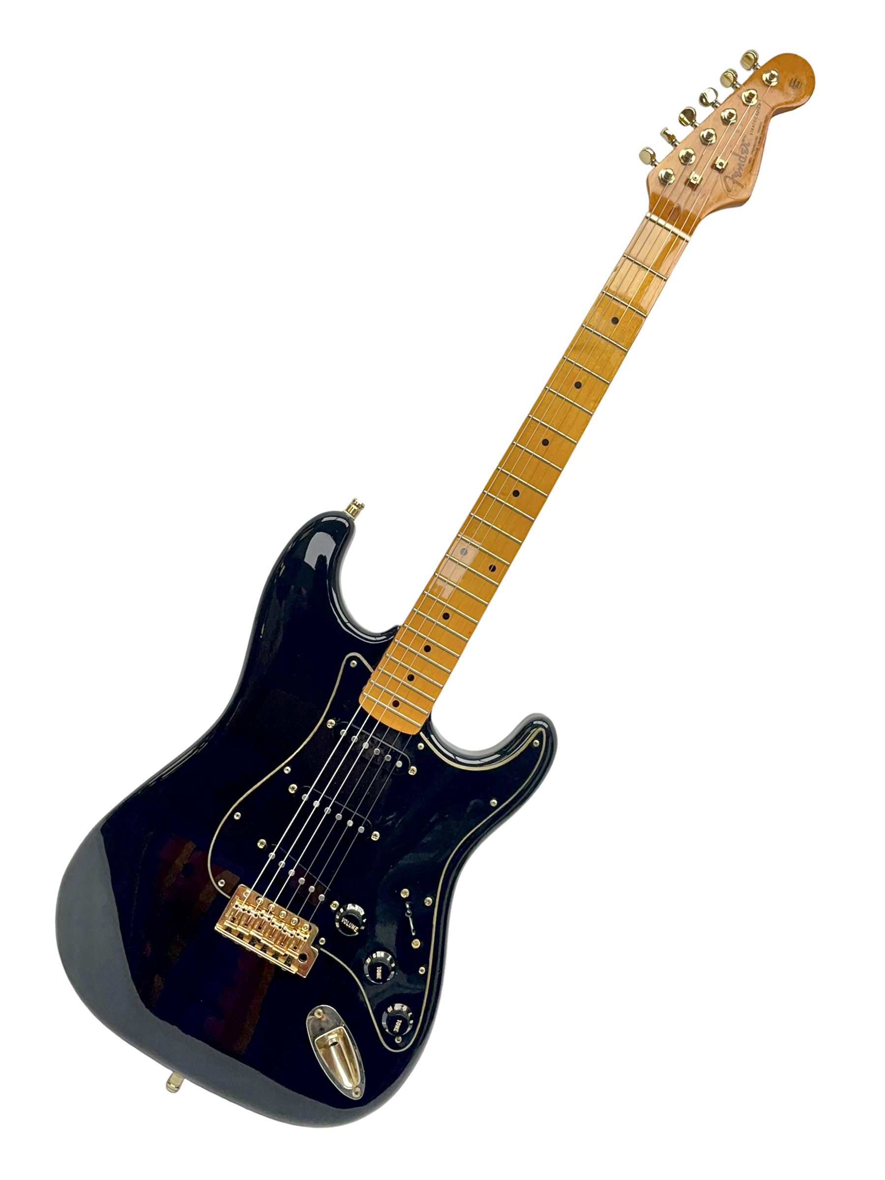 Copy of a Fender Stratocaster electric guitar in black with Wilkinson bridge