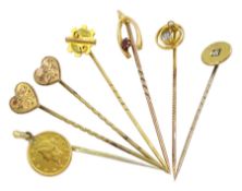 Seven Victorian and later gold stick pins including two hearts