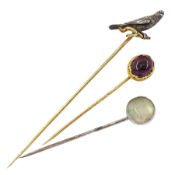 Three Victorian stick pins including silver and gold falcon / kestrel bird