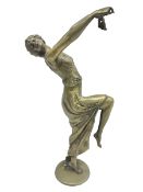 Brass figure of a female dancer with outstretched arms holding a mask H47cm