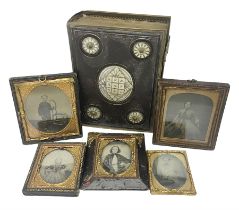 Five Victorian framed Daguerreotypes and a mother of pearl inlaid leather album of Victorian photogr