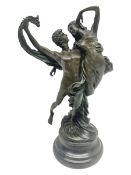 Bronze modeled as entwined dancers