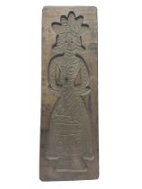 Wooden gingerbread mould modelled as a woman in traditional dress