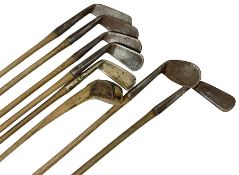 Collection of vintage wooden shaft golf clubs