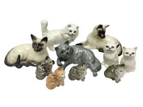 Ten ceramic cat figures