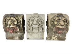 Three stone grotesques