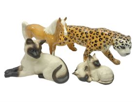 Four Beswick figures