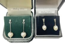 Two pairs of silver and pearl pendant earrings