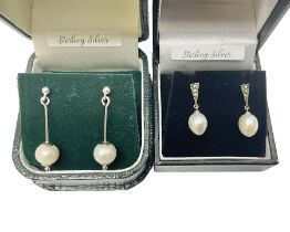 Two pairs of silver and pearl pendant earrings