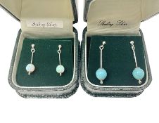 Two pairs of silver stone set pendant earrings