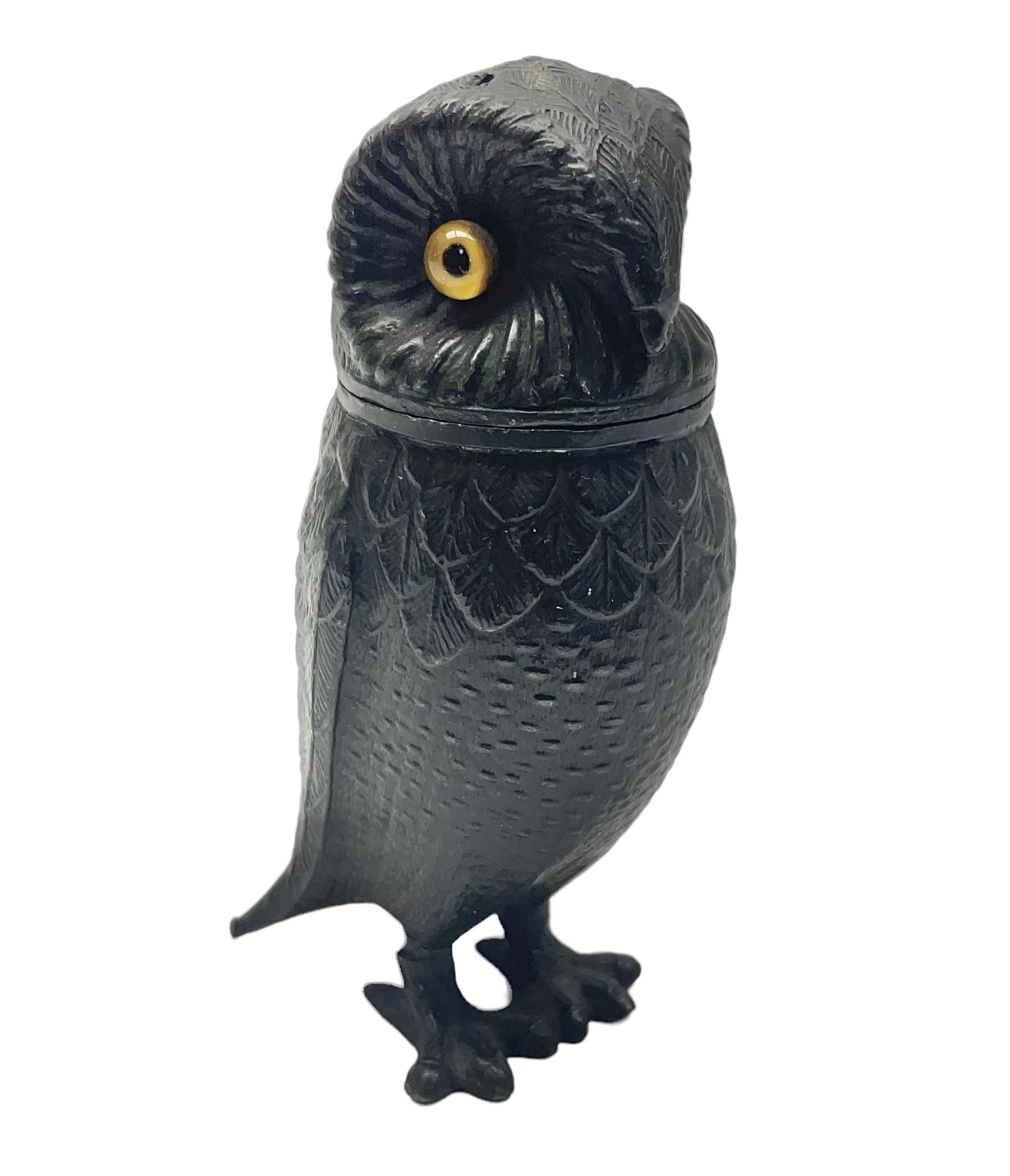 Novelty pewter pepper shaker in the form of an owl with screw off head and glass eyes