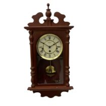 A contemporary 21st century wall clock in a mahogany finished case with a fully glazed door