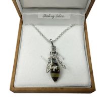 Silver Baltic amber honey bee pendant