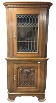 Arts & Crafts period oak corner cabinet