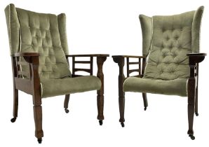 Pair of Arts and Crafts period oak framed wingback armchairs