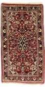 Persian crimson ground rug or mat