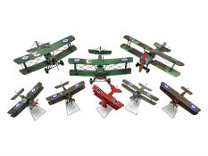 Three large painted tin-plate models of bi-planes