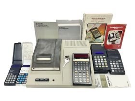 Four 1970s Sinclair electronic calculators - Cambridge in hard case with booklet; Scientific Program