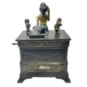 American 'Organ Bank' musical cast-iron mechanical money bank with hand cranked action and seated fi