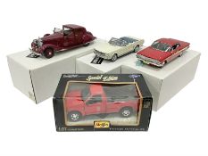 Four metal die-cast models of cars comprising two 1:24 scale Danbury Mint examples