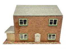 Scratch-built wooden doll's house of double fronted form with side garage