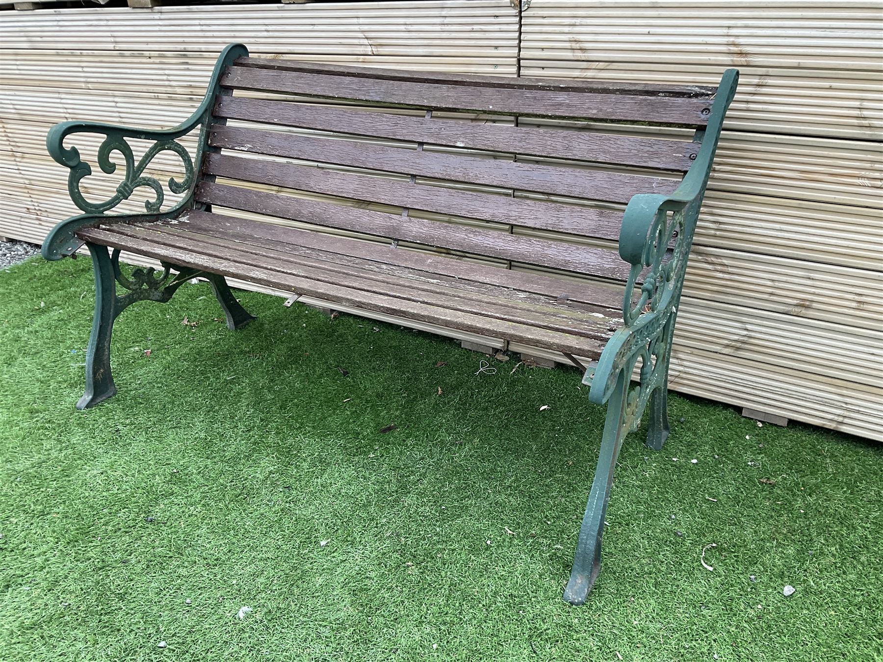 Cast metal and wood slatted garden bench