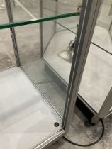 Aluminium and glass two tier display cabinet on castors and inside lights