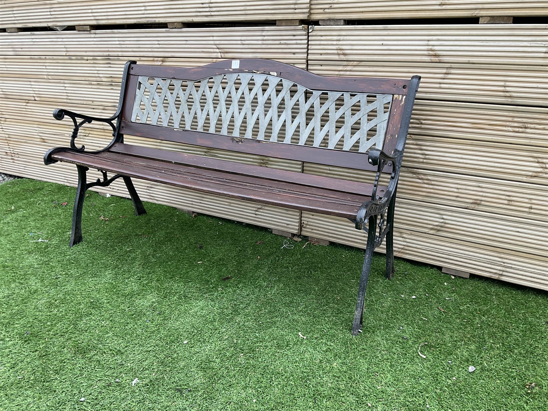 Large cast metal and wood slatted garden bench with lattice back