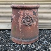 Terracotta chimney pot decorated with rose head motifs