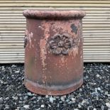 Terracotta chimney pot decorated with rose head motifs