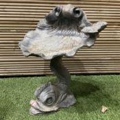 Lead bird bath in the form of a shell on a dolphin