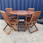 Hardwood drop leaf garden table on castors and folding chairs