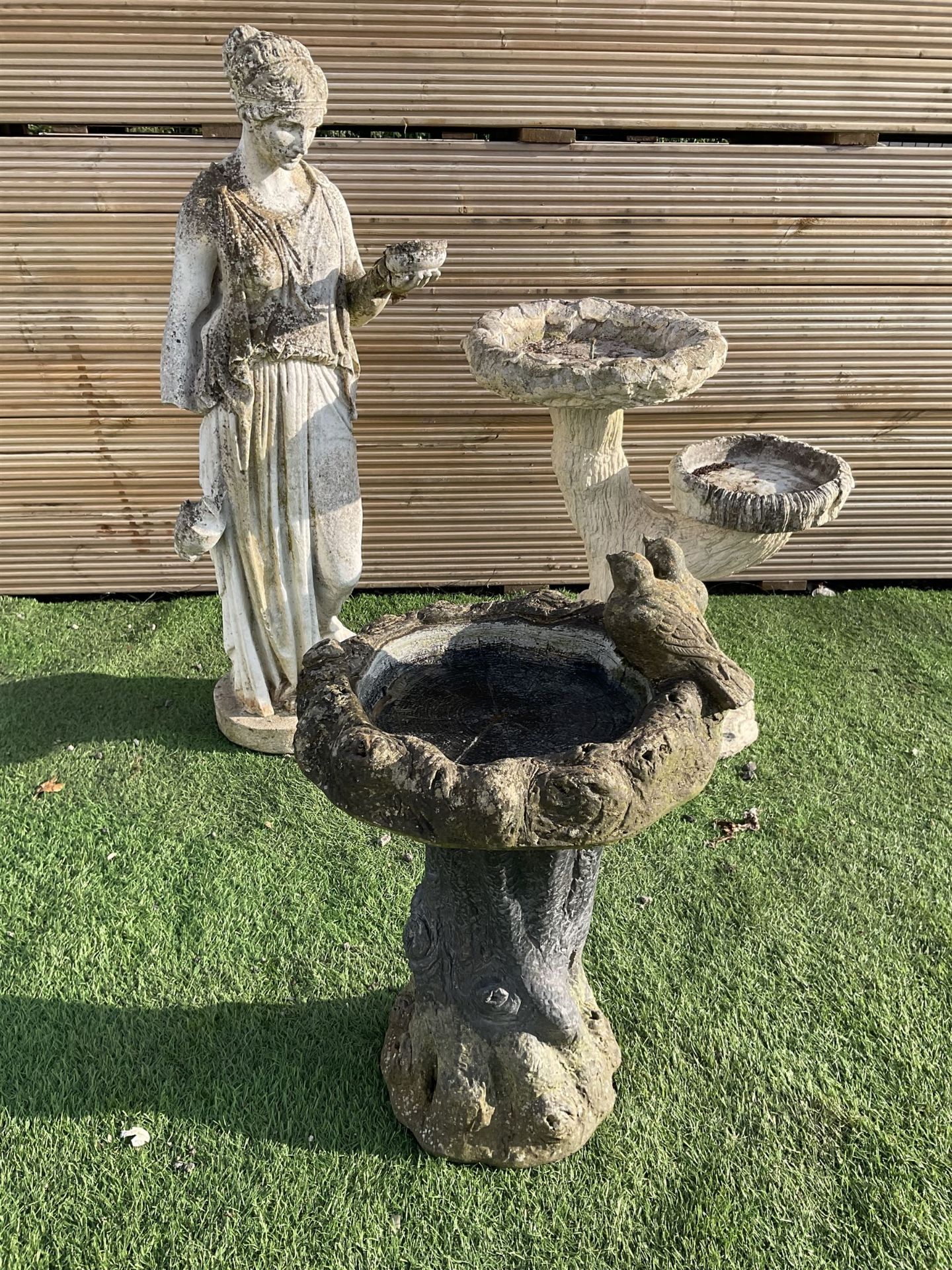 Cast stone garden figure and two bird baths