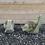 Two cast stone snail ornaments