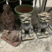 Set of four cast stone Chinese garden ornaments and green glazed terracotta pot