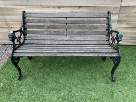 Cast metal and wood slatted garden bench