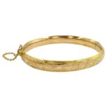 Gold hinged bangle