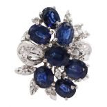 Oval cut sapphire and diamond cluster ring