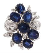 Oval cut sapphire and diamond cluster ring