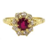 Early 20th century 18ct gold oval cut ruby and old cut diamond cluster ring