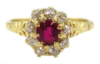 Early 20th century 18ct gold oval cut ruby and old cut diamond cluster ring
