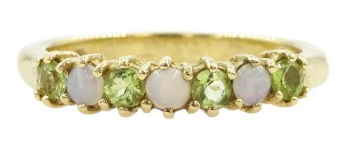 9ct gold seven stone peridot and opal ring