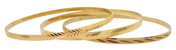 Two 17ct gold bangles and a 9ct gold bangle