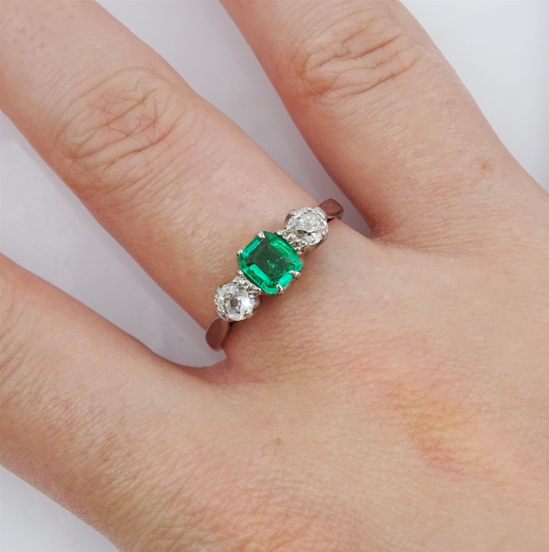 Early 20th century 15ct and palladium three stone emerald and old cut diamond ring - Image 2 of 4