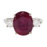 18ct white gold three stone oval cut ruby and round brilliant cut diamond ring