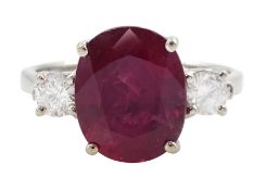 18ct white gold three stone oval cut ruby and round brilliant cut diamond ring