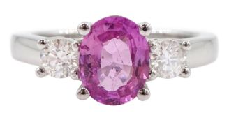 18ct white gold three stone oval cut pink sapphire and round brilliant cut diamond ring