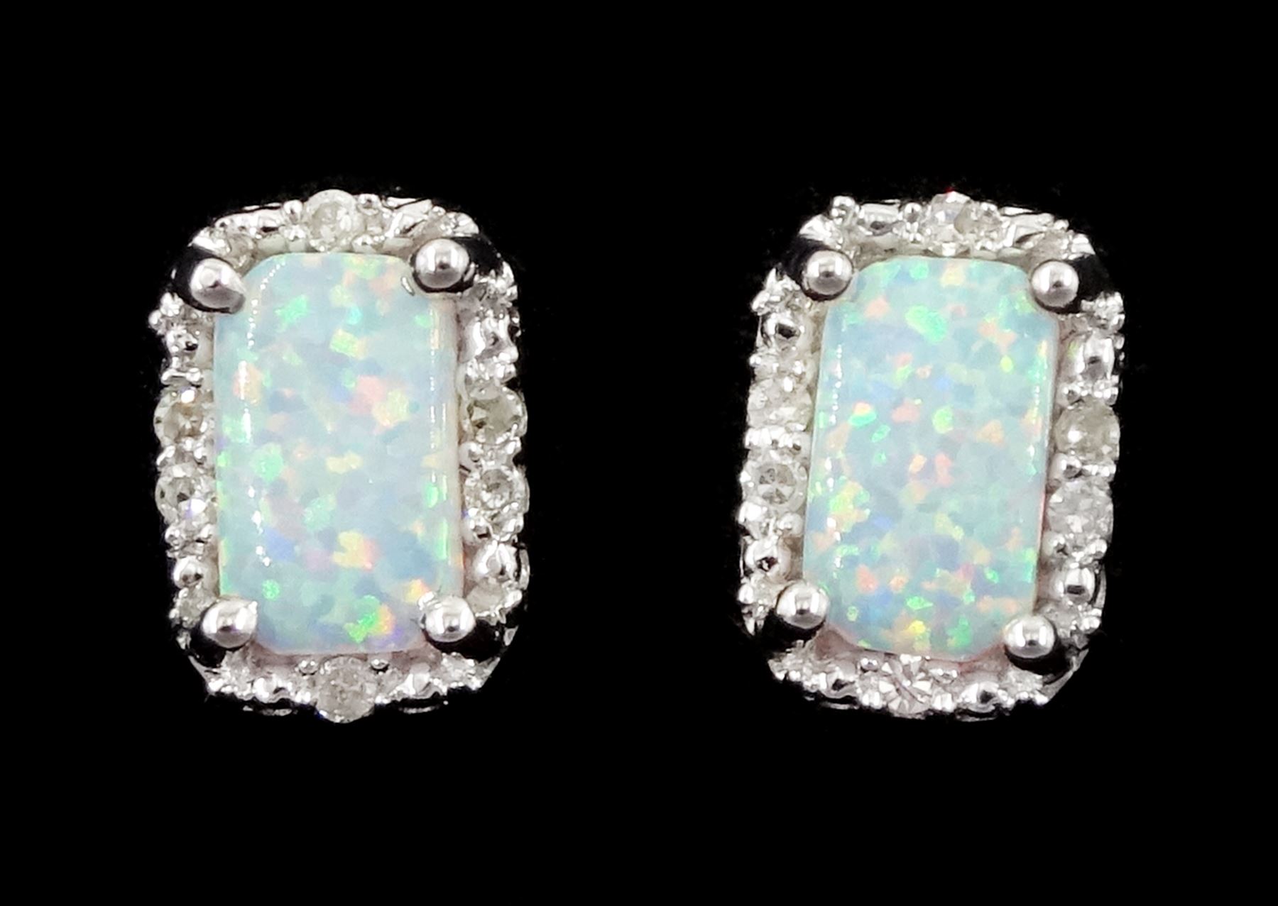 Pair of 9ct white gold opal and diamond stud earrings