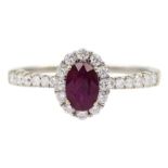 18ct white gold oval ruby and round brilliant cut diamond cluster ring